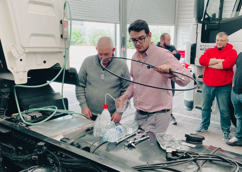 Men carrying out Jaltest diagnostic tool training