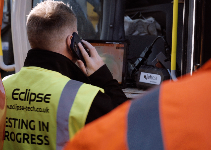 Man on phone offering technical support on Jaltest's vehicle diagnostic tools.