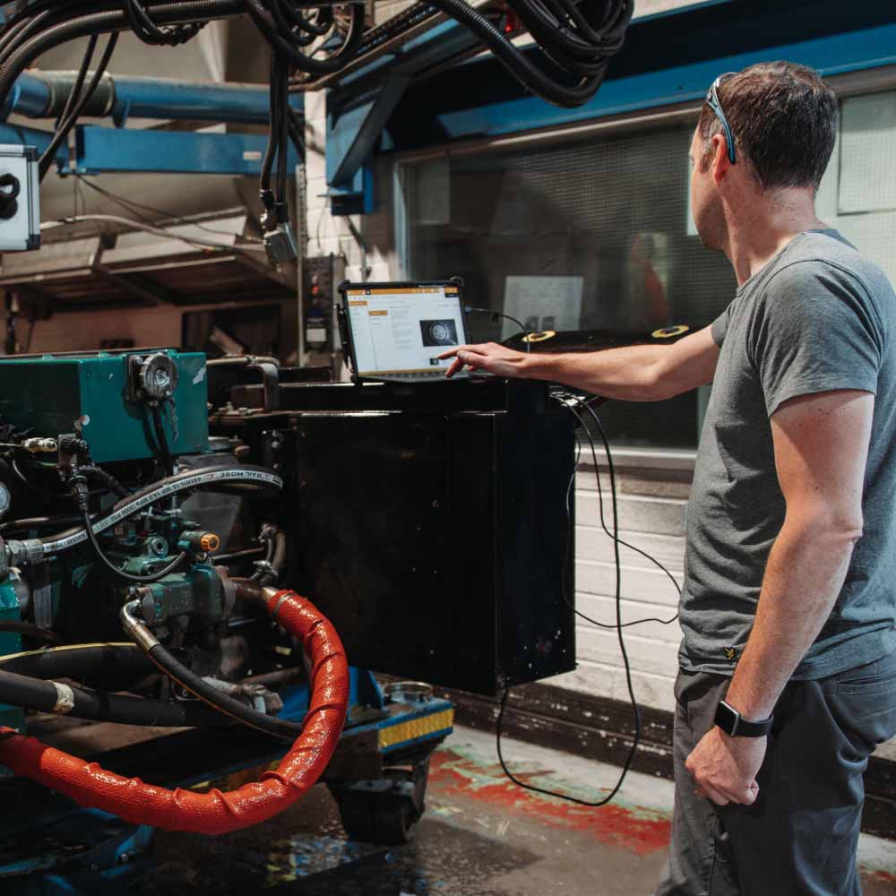 Man using vehicle diagnostics tool